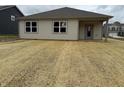 Rear exterior of home with covered patio and newly seeded backyard at 7533 Big Bend Blvd, Camby, IN 46113