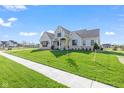 Attractive home featuring a lush green lawn and a welcoming front entrance at 8083 Easton Ln, Zionsville, IN 46077