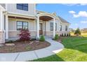 Charming home with inviting walkway leading to a covered front porch at 8083 Easton Ln, Zionsville, IN 46077