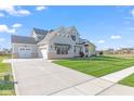 Spacious two-story home with an attached garage, set on a green lawn at 8083 Easton Ln, Zionsville, IN 46077
