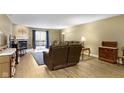 Comfortable living room with a fireplace, sliding door to the deck and neutral-toned decor at 8651 Jaffa Court East Dr # 18, Indianapolis, IN 46260