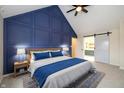 Stylish bedroom featuring a vaulted ceiling, barn door, and complementary colors at 950 Nevelle Ln, Carmel, IN 46032