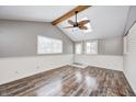 Bonus room features hardwood floors, light walls, skylight and a stylish ceiling fan at 9829 Chambray Dr, Indianapolis, IN 46280