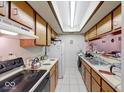 Functional kitchen featuring ample cabinet space and essential appliances for easy meal preparation at 9855 Haven Ct, Indianapolis, IN 46235