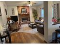 Inviting living room with a brick fireplace, plush seating, and cozy decor, ideal for gatherings at 11786 Ledgestone Cir, Fishers, IN 46037