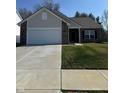 Charming single-story home with a well-manicured front yard and a two car garage at 142 Winding Brook Way, Pendleton, IN 46064