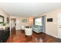 Cozy living room features hardwood floors, a comfortable couch, neutral walls, and bright natural light at 143 Beechview Ln, Indianapolis, IN 46217