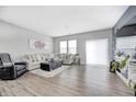 Spacious living room with large windows and sliding doors offer ample natural light and access to the backyard at 238 Switchgrass Ln, New Whiteland, IN 46184