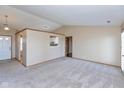 Bright, spacious living room featuring neutral walls and new carpet at 2680 Woodfield Blvd, Franklin, IN 46131