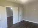 Bedroom with an open doorway and new flooring at 302 Sanders St, Indianapolis, IN 46225