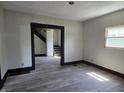 Spacious living room with stairs and gray flooring at 325 Harlan St, Indianapolis, IN 46201