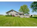 Inviting home with a spacious lawn and peaceful surroundings at 403 N Red Gold Dr, Trafalgar, IN 46181