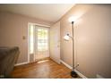 Foyer with hardwood floors and a view to the outside through the front door at 4710 E 56Th St, Indianapolis, IN 46220