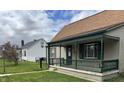 Inviting bungalow-style home with a covered front porch, complemented by well-kept landscaping at 518 N Grant St, Lebanon, IN 46052