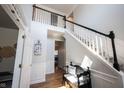 Inviting foyer featuring hardwood floors, staircase, and decorative accents at 5624 Ottawa Pass, Carmel, IN 46033