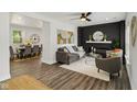 Bright living room boasts hardwood floors, a decorative fireplace, and an open layout that offers space for entertaining at 625 N Temple Ave, Indianapolis, IN 46201