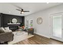 Bright living room boasts hardwood floors, a decorative fireplace, and an open layout that offers space for entertaining at 625 N Temple Ave, Indianapolis, IN 46201