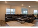 Comfortable living room with plush sectional sofa, neutral rug, and large windows for ample natural light at 6304 Frst Brk Dr, Indianapolis, IN 46259