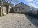 Backyard featuring a gravel area with debris and partial fencing at 818 W 27Th St, Indianapolis, IN 46208