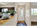 Entryway with decorative floor tiles and view to kitchen at 1043 E Castle Ave, Indianapolis, IN 46227