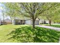 Charming single-Gathering home featuring a well-maintained lawn, a two-car garage, and inviting curb appeal at 11651 Beardsley Way, Fishers, IN 46038