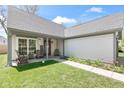 Charming front porch with cozy seating, decorative plants, and a welcoming entrance at 11651 Beardsley Way, Fishers, IN 46038