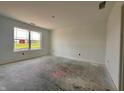 A light-filled bedroom with a large window and smooth, neutral walls offering a blank canvas for personalization at 1319 Fleming Dr, Greenfield, IN 46140