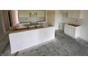 A kitchen featuring white cabinets and an island, waiting for customization and offering a modern, minimalist design at 1319 Fleming Dr, Greenfield, IN 46140