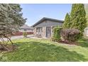 Charming stone home with lush lawn and mature trees at 1850 Cruft St, Indianapolis, IN 46203