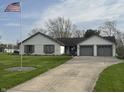 Charming home with American flag, brick accents, and two-car garage at 1873 W 950 S, Pendleton, IN 46064