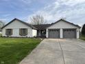 Charming home with brick accents, well-manicured lawn, and two-car garage at 1873 W 950 S, Pendleton, IN 46064