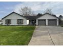 Charming home with brick accents, well-manicured lawn, and two-car garage at 1873 W 950 S, Pendleton, IN 46064