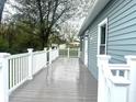 Spacious outdoor deck featuring white railing and gray decking is perfect for relaxing and entertaining at 410 S 25Th Ave, Beech Grove, IN 46107
