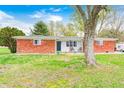 Charming brick ranch home with a cozy front porch and well-maintained lawn at 5541 S County Road 150 E, Clayton, IN 46118