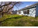 Rear exterior view with blue siding, a view of the river, and mature trees at 5708 Crystal Bay W Dr, Plainfield, IN 46168