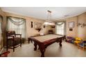 Game room with pool table and decorative lighting, offering a perfect space for entertainment at 5886 N Peppereel Way, McCordsville, IN 46055