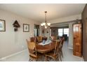 Inviting dining room with wood table, chandelier, and neutral decor, perfect for Gathering meals and entertaining at 6075 Bristlecone Dr, Fishers, IN 46038