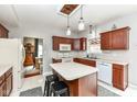 This kitchen has modern appliances, an island with seating and leads into a dining area at 693 Prince Dr, Greenwood, IN 46142