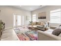 Bright living room with comfortable seating, a stylish rug, and ample natural light at 926 Olive St, Indianapolis, IN 46203