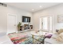 Bright living room with comfortable seating, a stylish rug, and ample natural light at 926 Olive St, Indianapolis, IN 46203