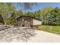Large two-car detached garage with ample storage space, ideal for car enthusiasts or workshop needs at 10912 N County Road 950 E, Brownsburg, IN 46112