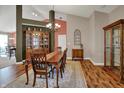 Dining area with wood table, chandelier, adjacent to living area, great for gatherings at 1649 Woodfield Dr, Greenwood, IN 46143