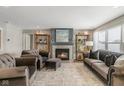 Beautiful living room with cozy fireplace and plenty of natural light at 19602 Atwater Ave, Sheridan, IN 46069