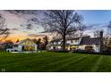 Backyard features a pool, poolhouse, and meticulous landscaping offering a serene outdoor experience at 1995 W 116Th St, Carmel, IN 46032