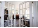 Inviting view of living room through french doors with a piano and stylish furnishings, creating an elegant space at 2261 Mustang Chase Dr, Carmel, IN 46074