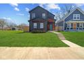 View of exterior of home with large green lawn at 2325 E Brookside Ave, Indianapolis, IN 46218