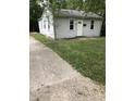 Quaint single-story home with a well-kept lawn and welcoming entrance at 2413 N Macedonia Ave, Muncie, IN 47303