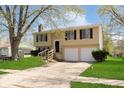 Charming two-story home with a well-maintained lawn and a two-car garage at 2601 Fairhaven Dr, Indianapolis, IN 46229