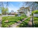 Inviting home with a lush green lawn and classic architectural details at 3515 Guilford Ave, Indianapolis, IN 46205