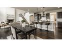 Modern kitchen with granite countertops, stainless steel appliances, and a breakfast bar at 4428 Voyageur Way, Carmel, IN 46074